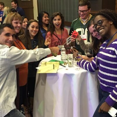 Employees having fun while drinking wine