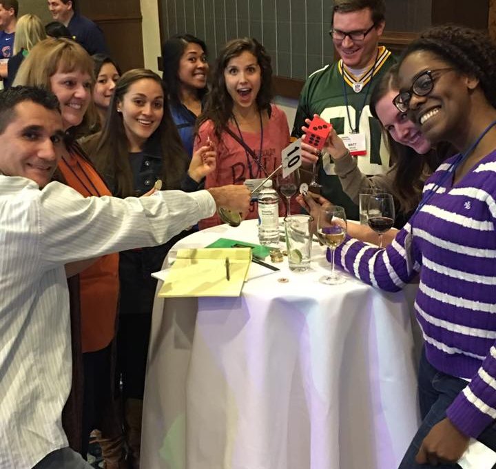Employees having fun while drinking wine