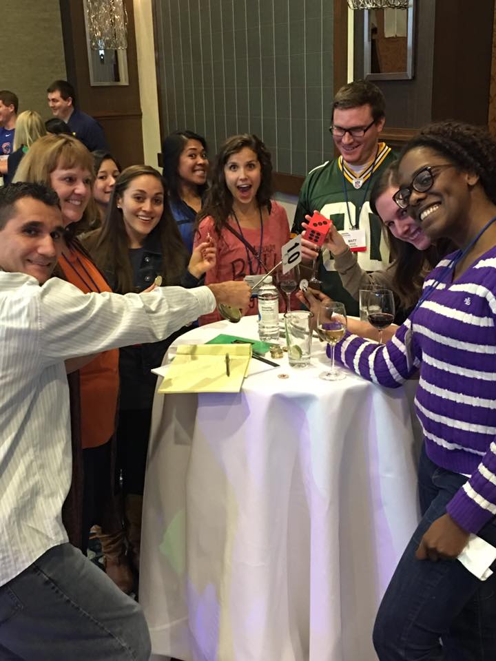 Employees having fun while drinking wine