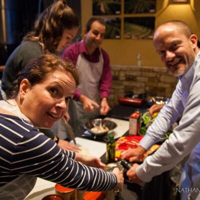 Employees enjoying helping each other while cooking thumbnail