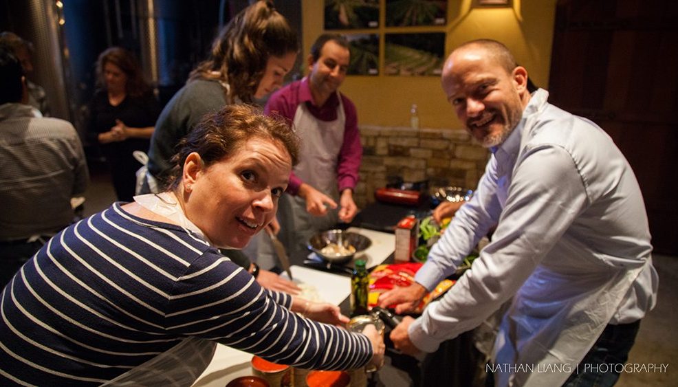 Employees enjoying helping each other while cooking