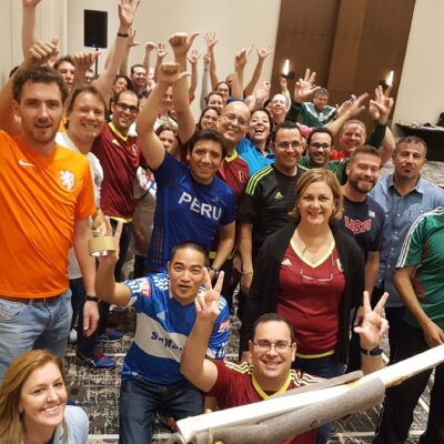 Group of people taking their Pictures while raising their hands thumbnail