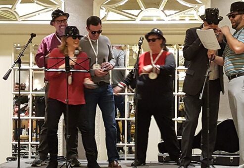 A group of people performing their Intermission