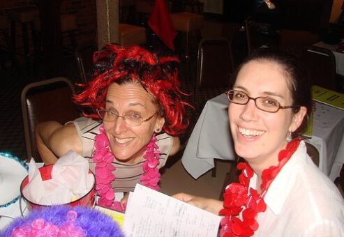 Employees taking a selfie with the one has weird hair by TeamBonding