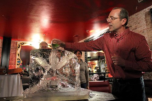 Group of people does some sculpting in ice
