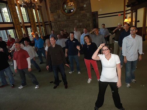 Employees having fun dancing at a Team Building Event organized by TeamBonding