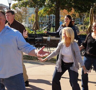 Employees having fun dancing at a Team Building Event organized by TeamBonding