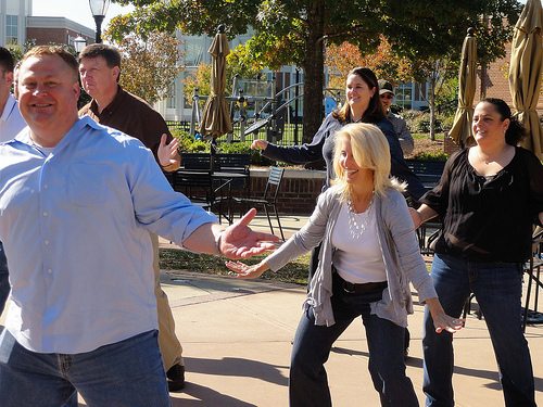 Employees having fun dancing at a Team Building Event organized by TeamBonding