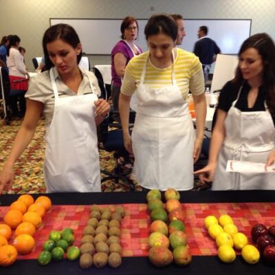 Employees analyzing and counting fruits