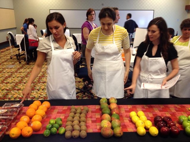 Employees analyzing and counting fruits