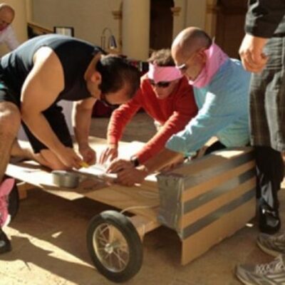 Group of men building a cart