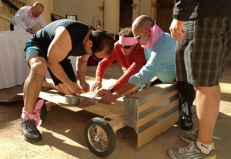 Group of men building a cart