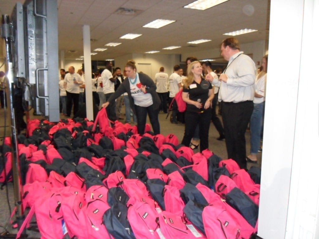 Employees ready for bags giveaway