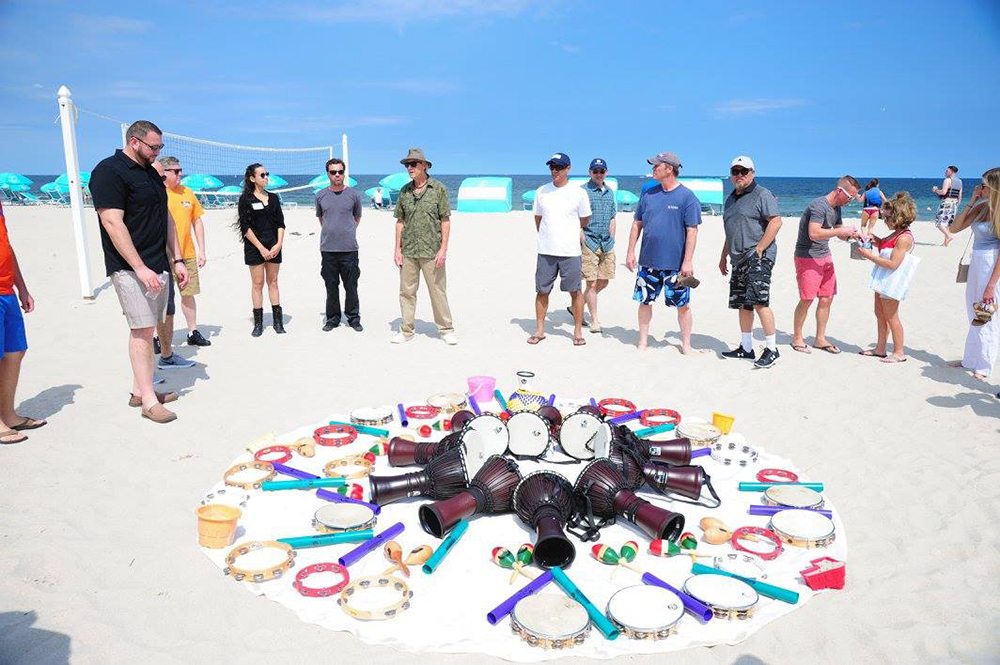 Group of people Making a circle with their musical instrument in the center