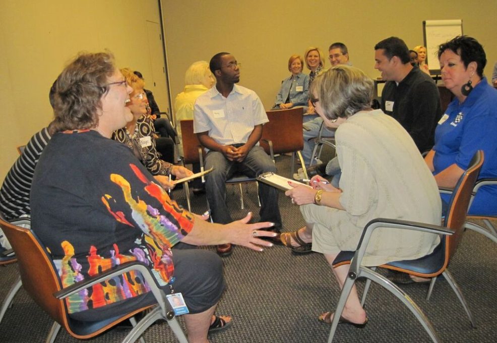 Employees and participants a happy team discussion during leadership training