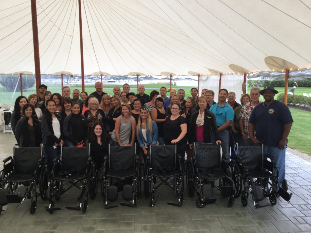 Group of people taking their shot with their wheelchair