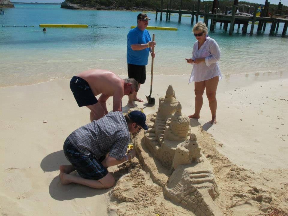 Employees make some sand castle