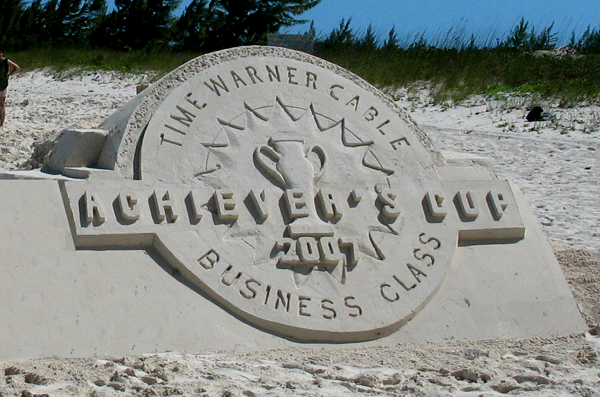 Employees participate in outdoor sand sculpting contest by TeamBonding