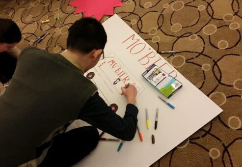 A man drawing in a Cardboard