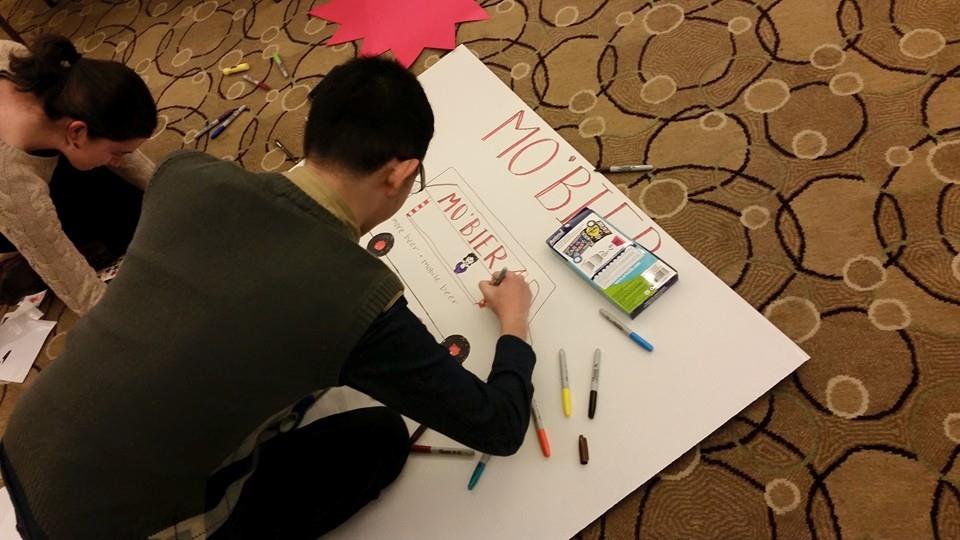 A man drawing in a Cardboard