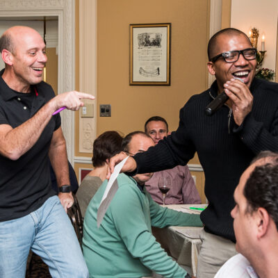 Event host leads the Wild Card Team Building Bingo session with enthusiasm, creating an engaging and lively atmosphere. thumbnail