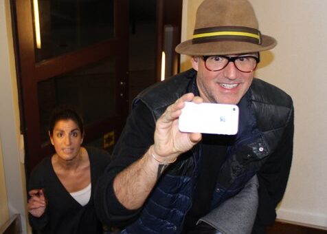 An employee having fun taking pictures at Scavenger Hunt Event by TeamBonding