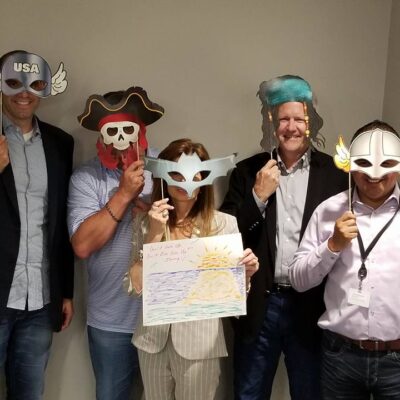 Employees masquerade picture taking during the leaders meeting