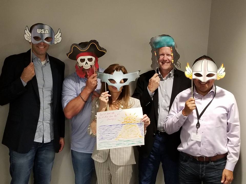 Employees masquerade picture taking during the leaders meeting