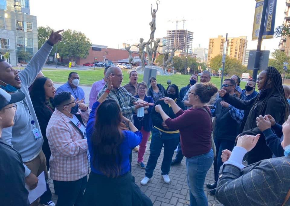 Participants energetically engaging in an outdoor challenge during the Pub Crawl Scavenger Hunt, fostering team spirit and connection in a lively city setting.