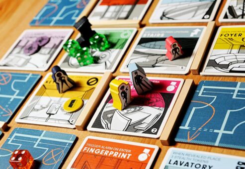 Image of the cartoons and dice on the game board