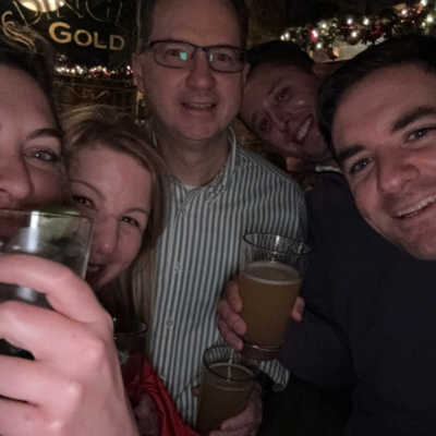 Team members share a cheerful moment with drinks in hand during the Pub Crawl Scavenger Hunt, creating lasting memories of camaraderie and fun. thumbnail