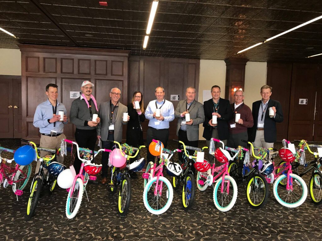 Teams put together bikes for charity