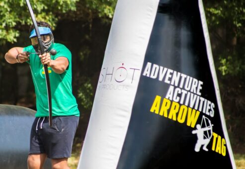 Image of the a man executing bow and arrow game