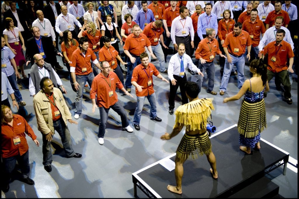 Employees participating in a Haka dance