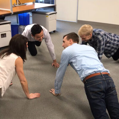 Employees doing push-ups thumbnail