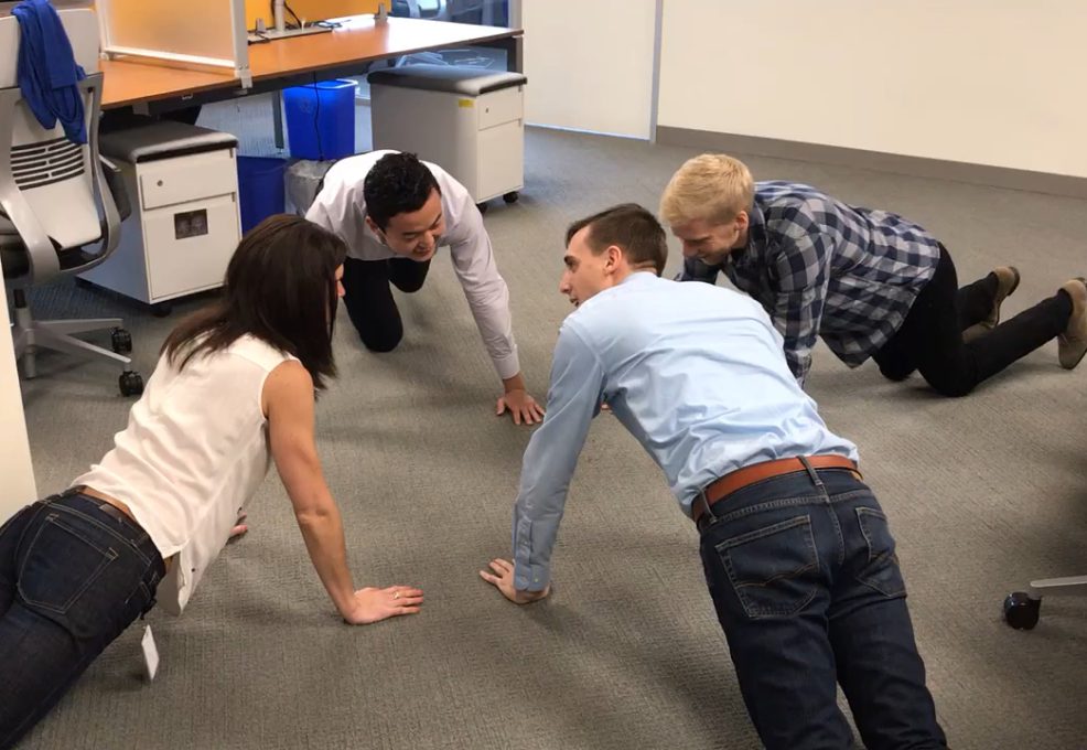 Employees doing push-ups