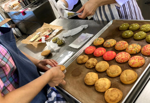 Decorating colorful cookies