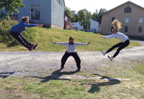 A group of team members completes a fun photo challenge during an outdoor team building activity, demonstrating their teamwork and enthusiasm. Their synchronized jumps showcase the fun, collaborative spirit of the event.