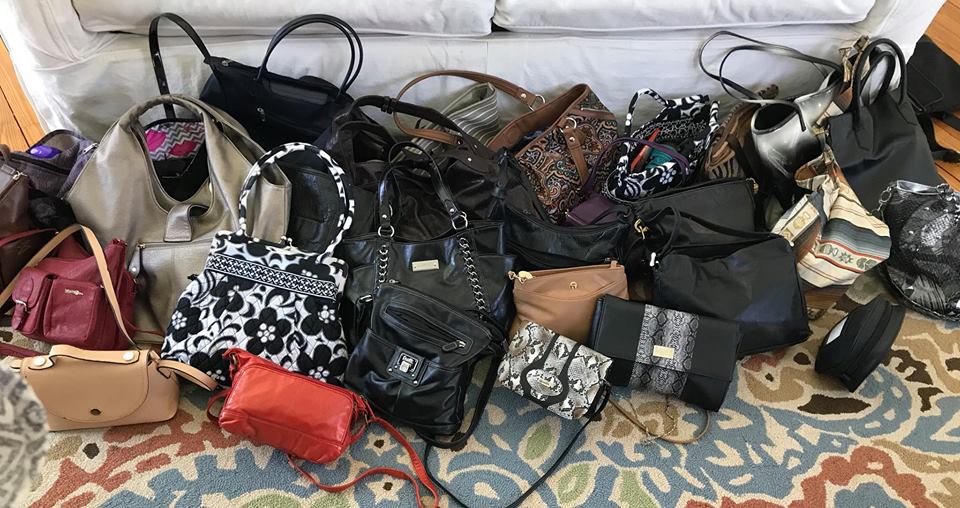 A variety of new and gently used handbags are gathered and ready to be filled with essentials during the Hopefull Handbags Global team building event, supporting domestic abuse survivors.