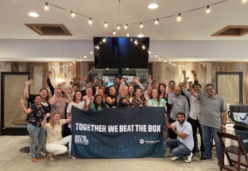 Excited group celebrating their victory after completing the Beat the Box team building event, showcasing the power of collaboration and critical thinking in achieving success.