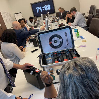 Teams focused on unlocking clues and solving puzzles during a Beat The Box team building event, with a ticking clock adding pressure to their collaboration and problem-solving efforts. thumbnail
