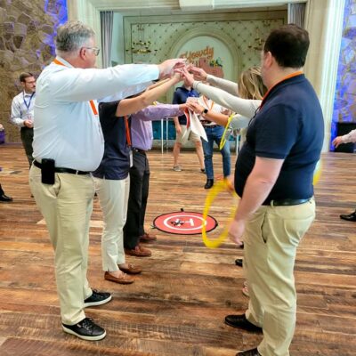 Participants work together to guide a drone through obstacles using teamwork and strategy during the Game of Drones team building event, fostering collaboration and problem-solving. thumbnail