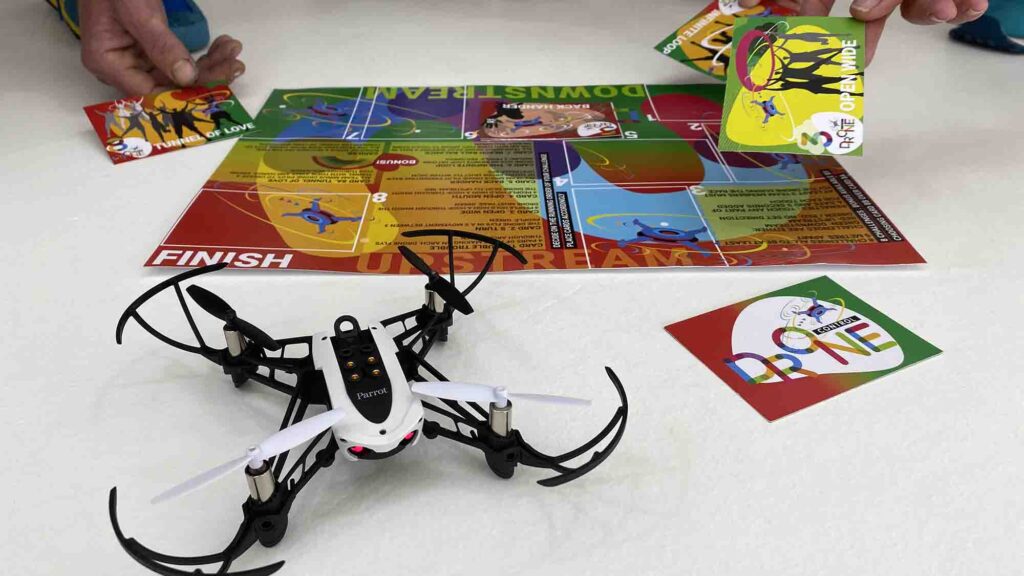 Close-up of a drone and obstacle cards during the Game of Drones team building event, highlighting strategic gameplay and teamwork.