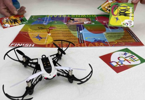 Close-up of a drone and obstacle cards during the Game of Drones team building event, highlighting strategic gameplay and teamwork.