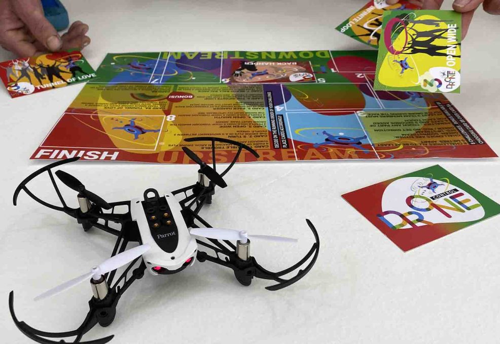Close-up of a drone and obstacle cards during the Game of Drones team building event, highlighting strategic gameplay and teamwork.