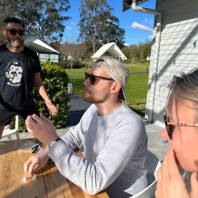 Team members participating in a fun outdoor team building activity, collaborating and strategizing. The event encourages teamwork, communication, and friendly competition in a relaxed setting. thumbnail