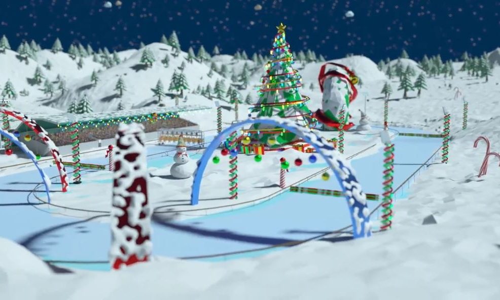 Snowy racetrack decorated with candy canes and Christmas lights, featuring a large Christmas tree, snowmen, and holiday-themed arches from the Reindeer Games team building event.