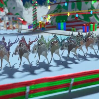 Reindeer sprinting around the track with festive holiday décor during the Reindeer Games team building event. thumbnail
