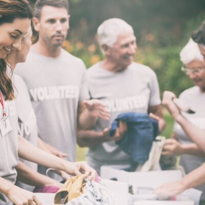Featured Image For Employee Volunteering: 5 Mental Health Benefits of Helping Others Team Building Post