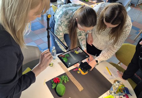 Team building activity using stop motion animation. Participants collaborate on a creative project, filming frame by frame to produce a seamless short film, emphasizing teamwork, communication, and storytelling.